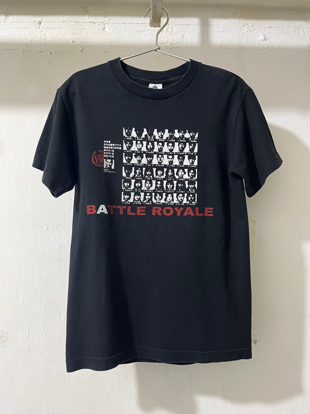 Black t-shirt with 'Battle Royale' graphic design on a white background