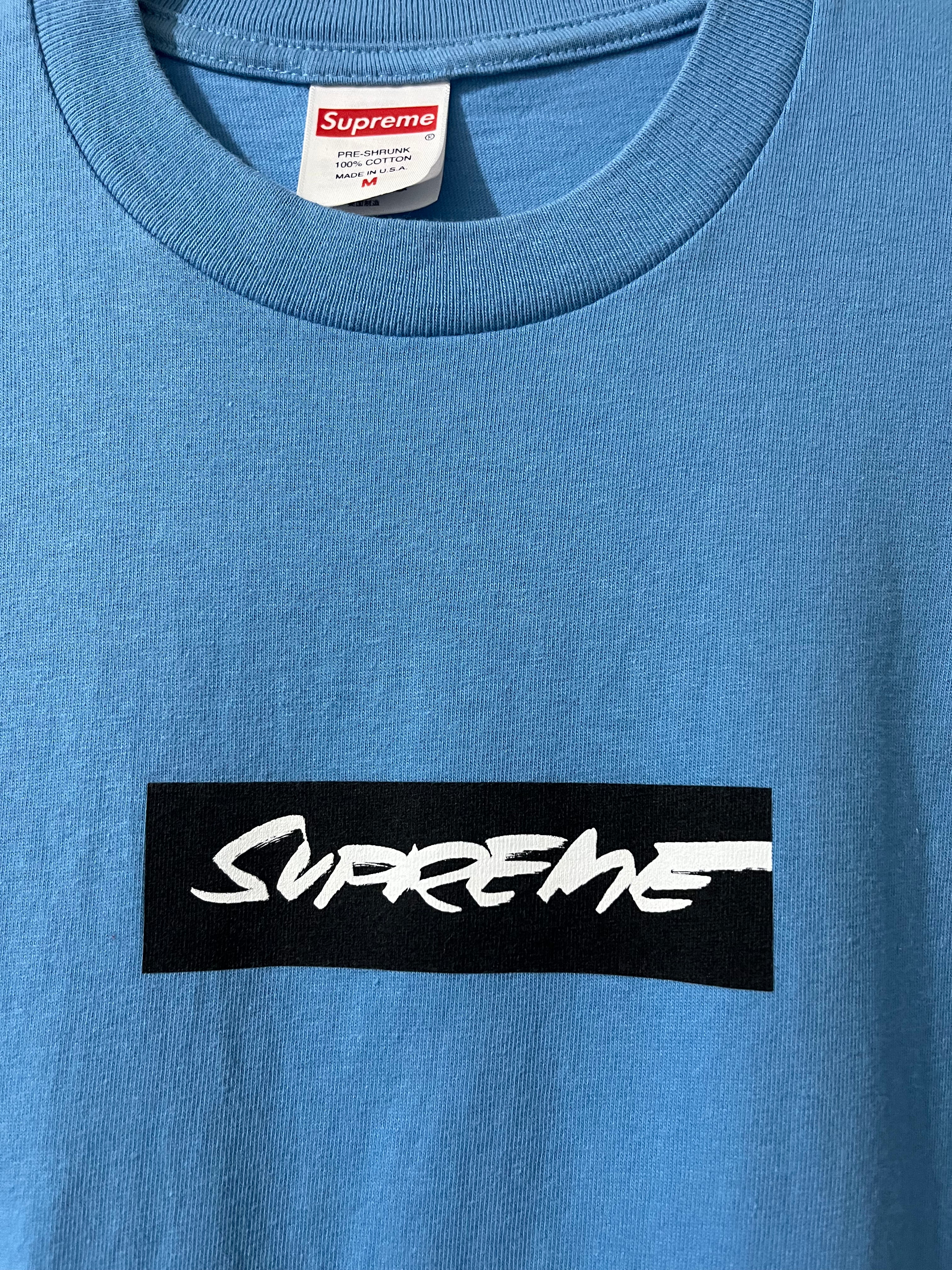 Blue t-shirt with Supreme logo on a white background