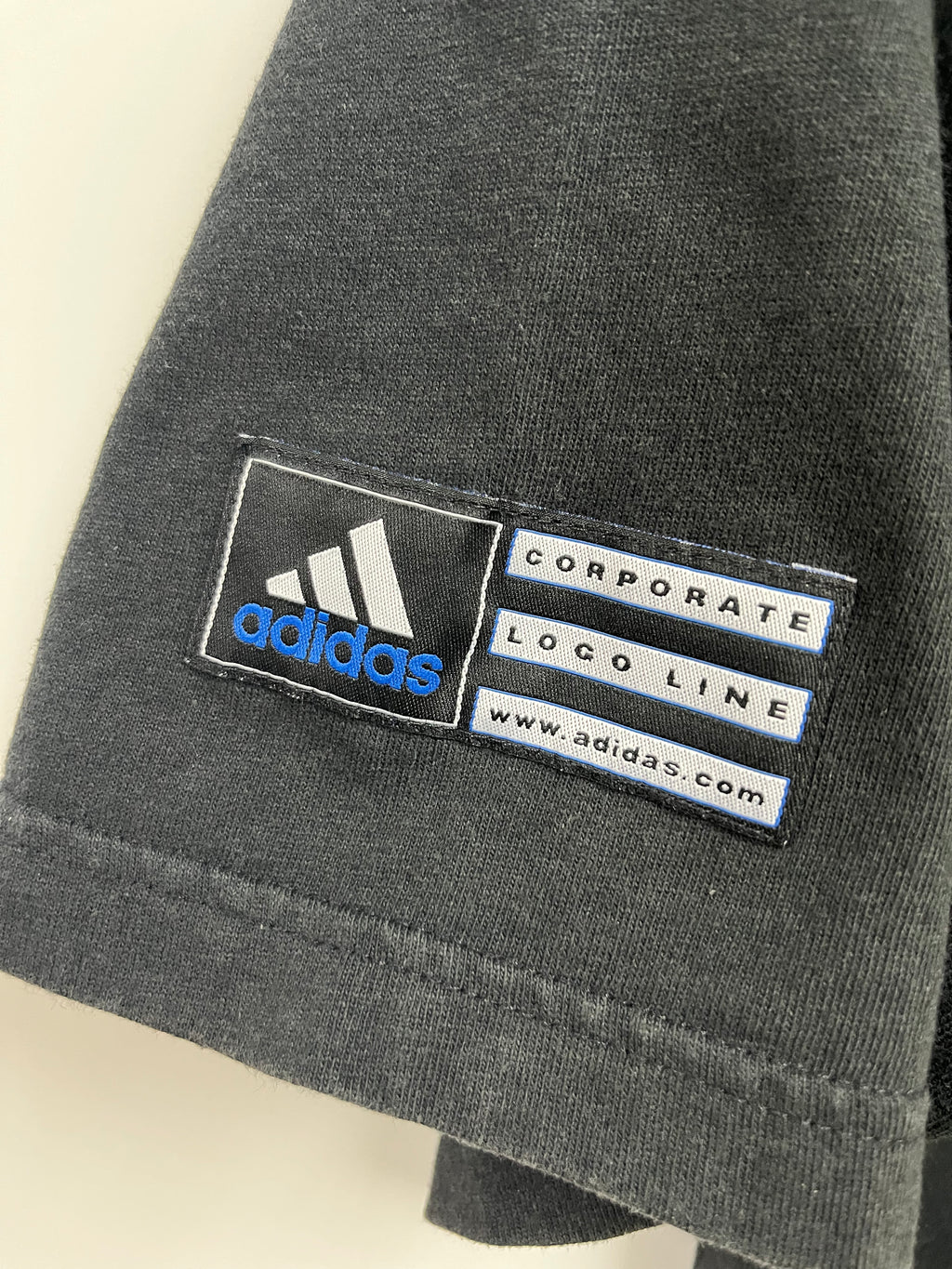ADIDAS CORPORATE LOGO LINE PATCH ON THE ARM